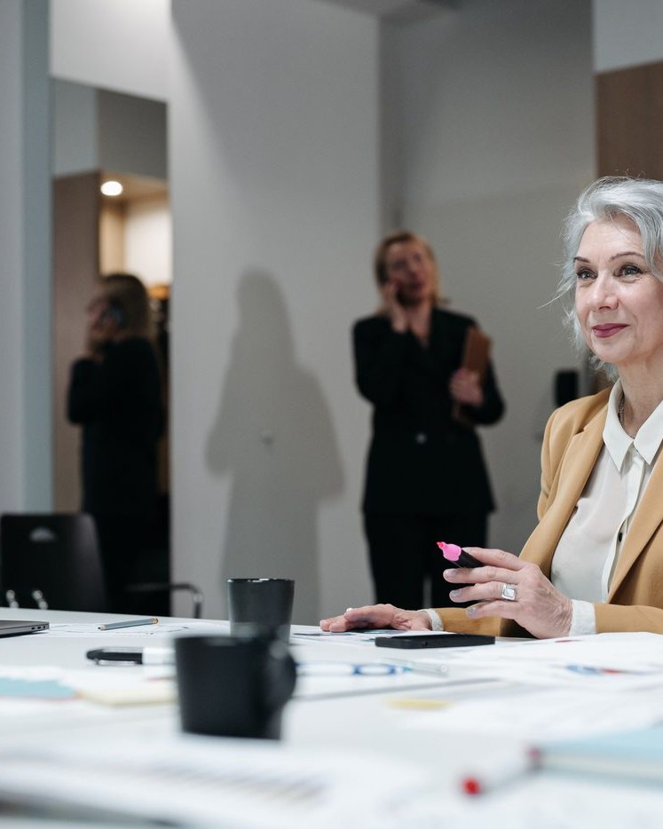 A working mother leading a meeting