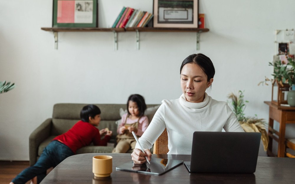 A working mother at her desk